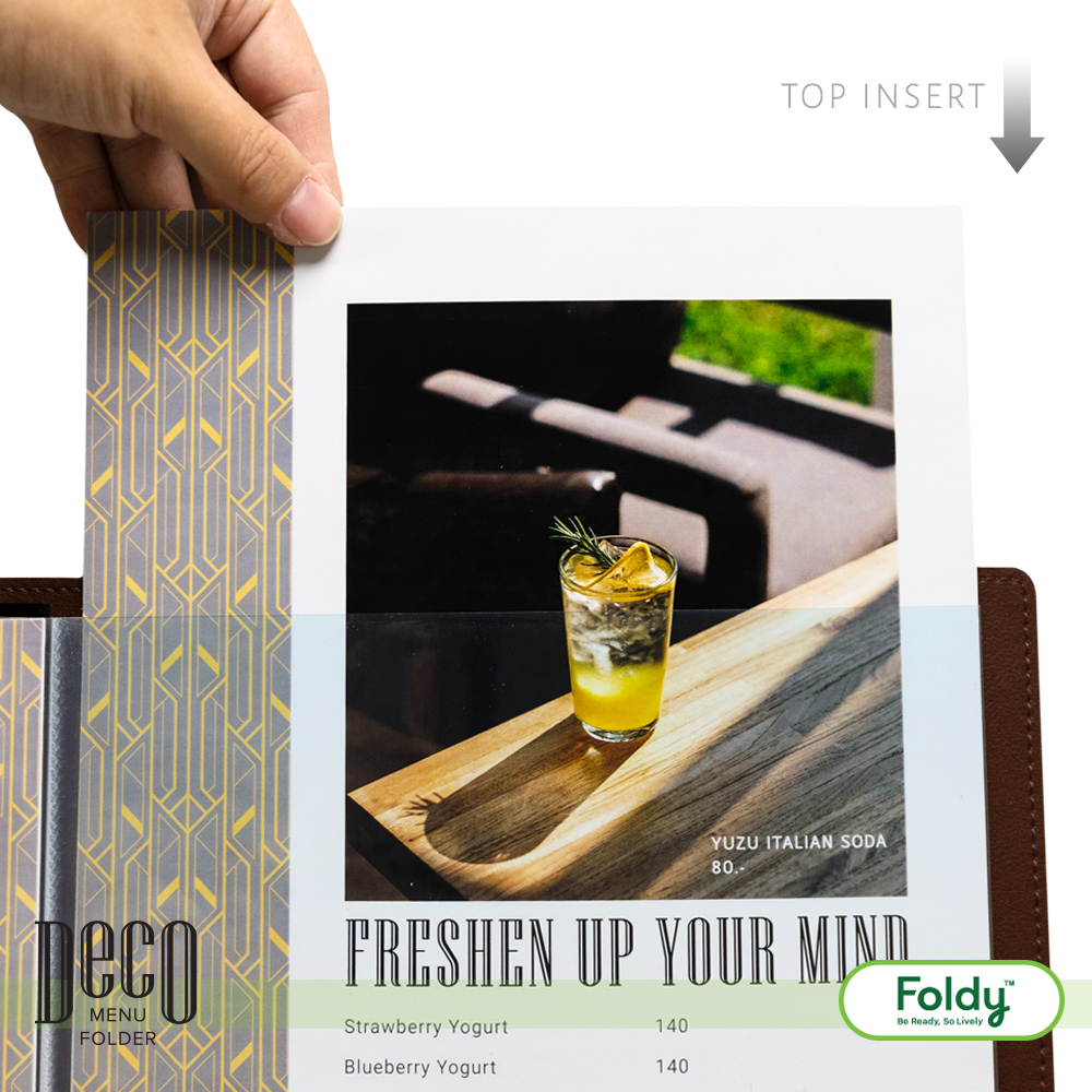 Menu page featuring a photo of a yellow cocktail on a wooden tray, with the caption 'FRESHEN UP YOUR MIND' and a decorative left-side insert.