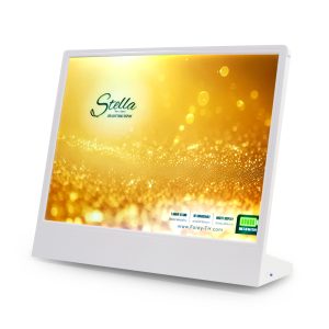 White, angled LED light table display on a stand showing a golden bokeh background (Stella branding).